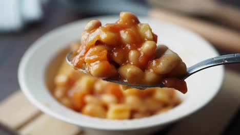 close up of a spoonful of white bean soup