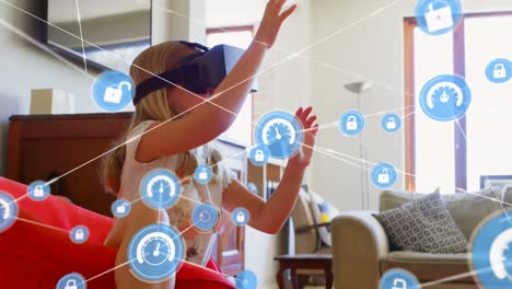 Network-of-digital-icons-against-caucasian-girl-wearing-vr-headset-at-home