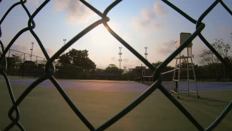 empty tennis court in morning with sunrise