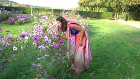 young women smelling on flowers