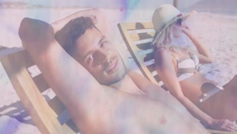 relaxing on beach chairs, man and woman enjoying animation under sunny sky