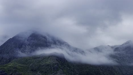 mountain peaks shrouded in sea fog and clouds