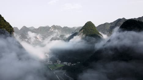 aerial: amazing cloudy karst mountain landscape in remote china