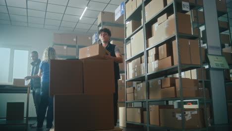 warehouse workers packing boxes