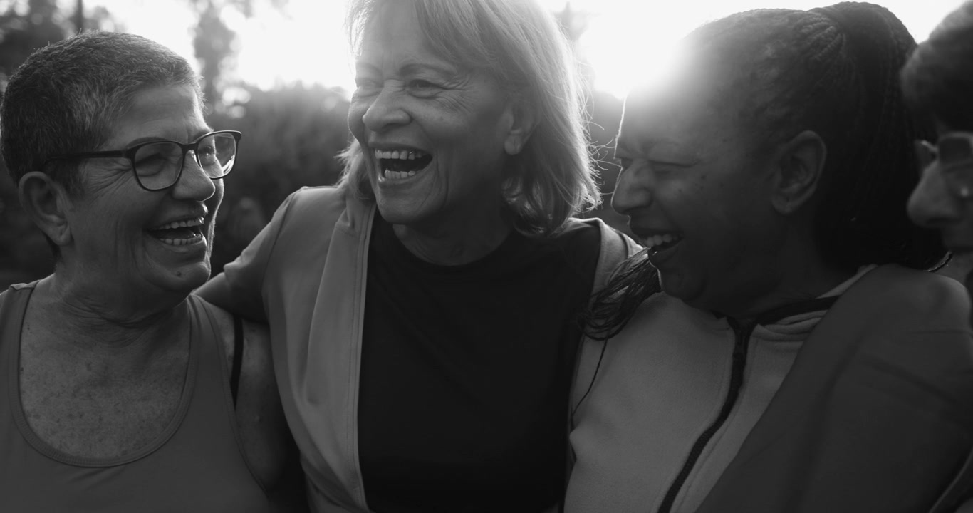Happy Multi-Ethnic Senior Women Laughing Together in Black and White