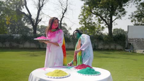 cute indian couple in a holi party