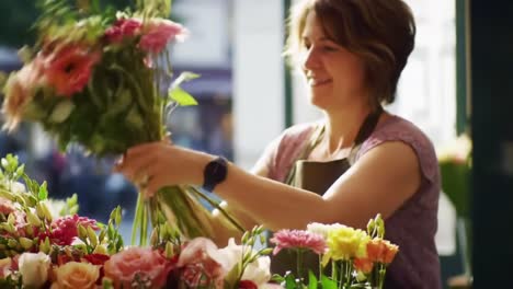 a blooming experience: a florist arranging beautiful bouquets full of colorful flowers in a sunlit flower shop environment