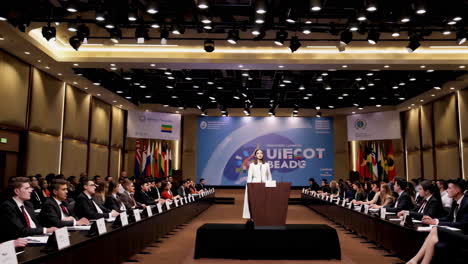young woman delivering a speech at an international youth conference