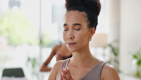 woman meditating in a yoga studio