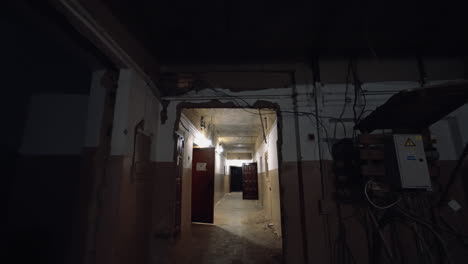 entering the corridor of the old building with the doors open to the rooms or no doors at all. reconstruction concept.