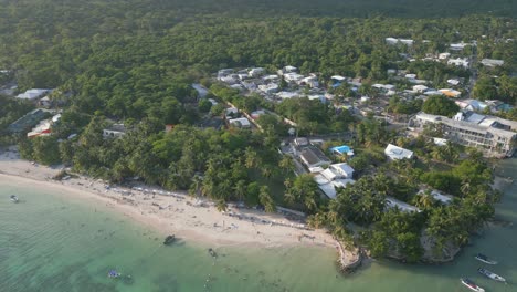aerial pull back wide shot of caribbean beach