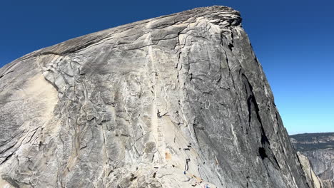 the backside of half dome in yosemite national park with the cable climbing system