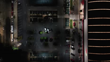 nighttime flyover of a shopping mall parking lot in the del valle neighborhood in mexico city