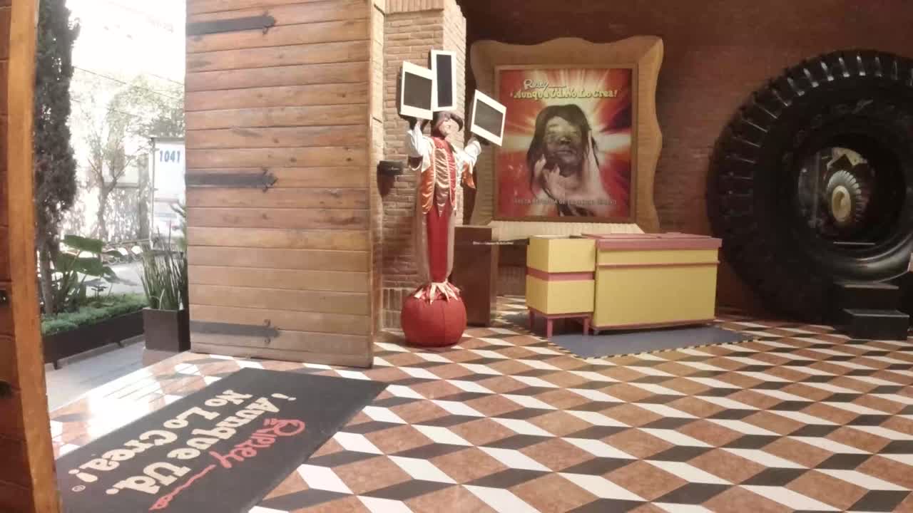 Ripley Logo on rug at the entrance of the museum, handheld zoom in