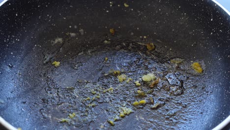 dirty frying pan with food residue