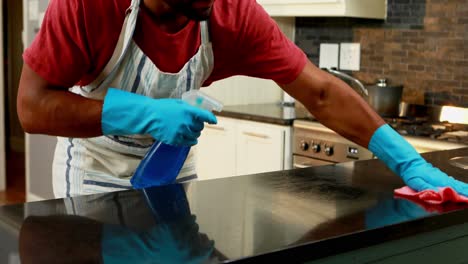 man cleaning the kitchen worktop 4k