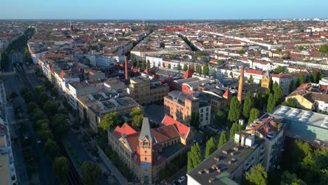 berlin's urban landscape, capturing a mix of residential and commercial buildings, streets, and green spaces. wonderful aerial view flight