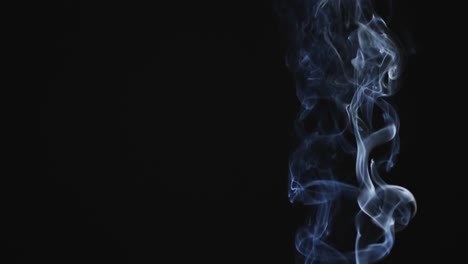 video of white clouds of smoke moving with copy space on black background