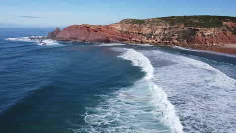 drone-circles-around-in-the-bay-of-telheiro-near-sagres-in-portugal,-beautiful-sunny-weather