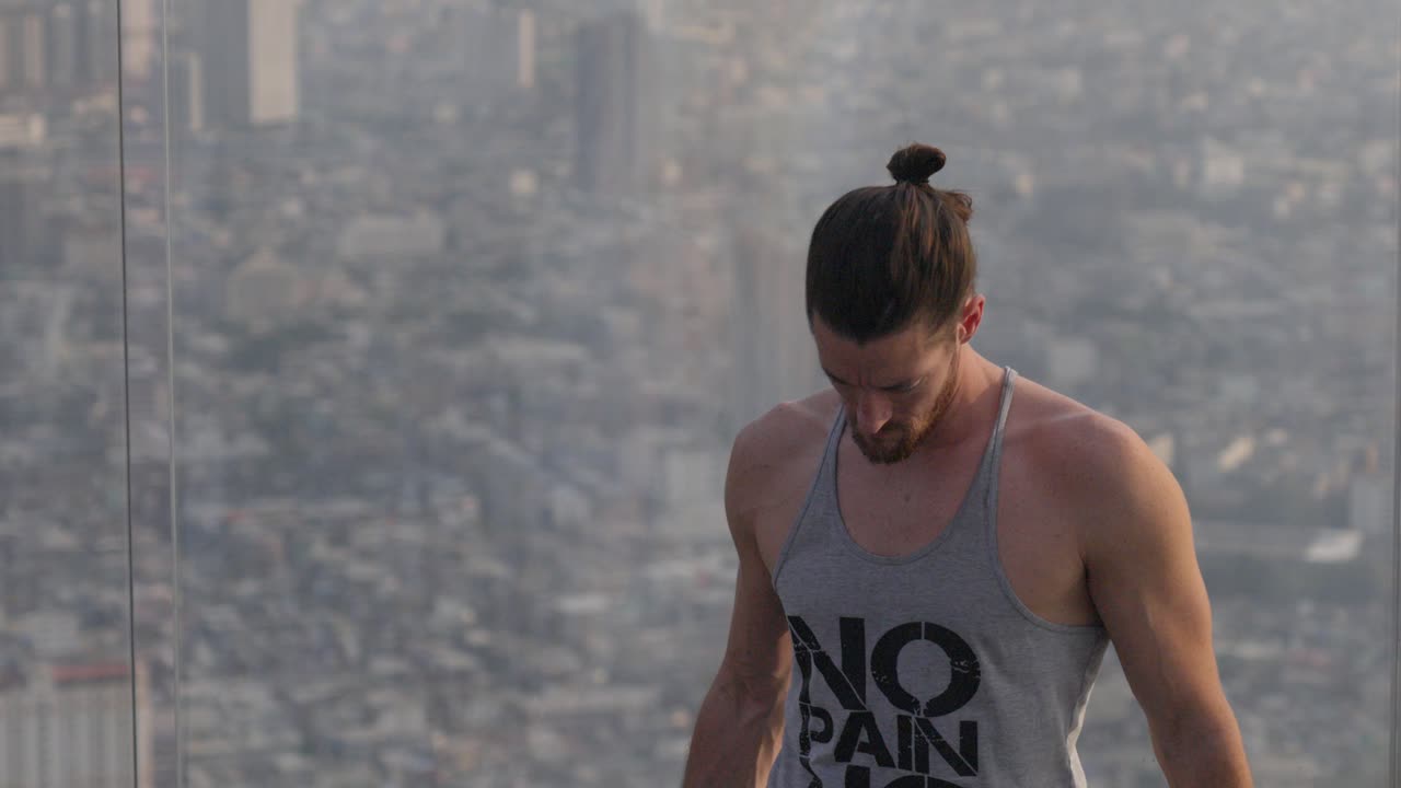 Slow motion shot of a tourist on the observational deck on the Mahanakhon tower