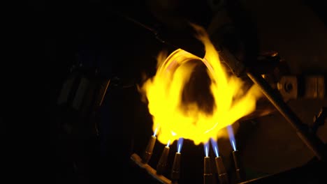 close-up of glass being created in glass factory 4k