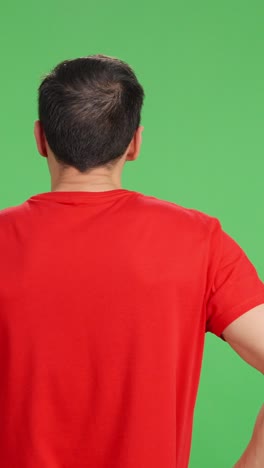 man with his back turned calmly contemplating something