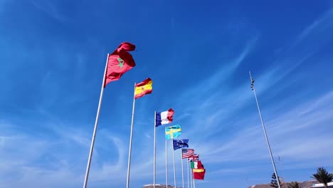 morocco spain france sweden europe nations flags usa italy wave agadir beach, clear blue sky