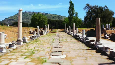 FPV-drone-flying-on-colonnaded-sacred-way-of-Sanctuary-of-Asclepius