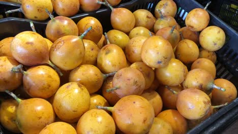 granadilla exposed in a box in a supermarket in south america