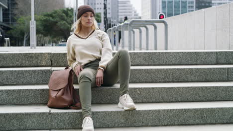 an attractive young woman sitting alone