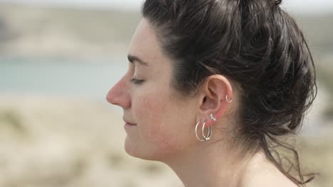 Woman-with-Ear-Piercings-Relaxing-with-Eyes-Closed-Focus-Shot