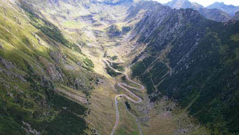 panoramic high angle aerial overview tilt down above transfagarasan serpentine road