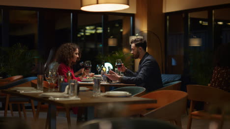 happy couple drinking wine glass in fancy restaurant table. romantic concept.