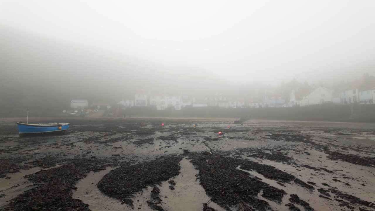 Very mist and foggy scene on the coast of the UK