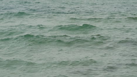 Slow-motion-of-turquoise-sea-water-rippling-on-surface