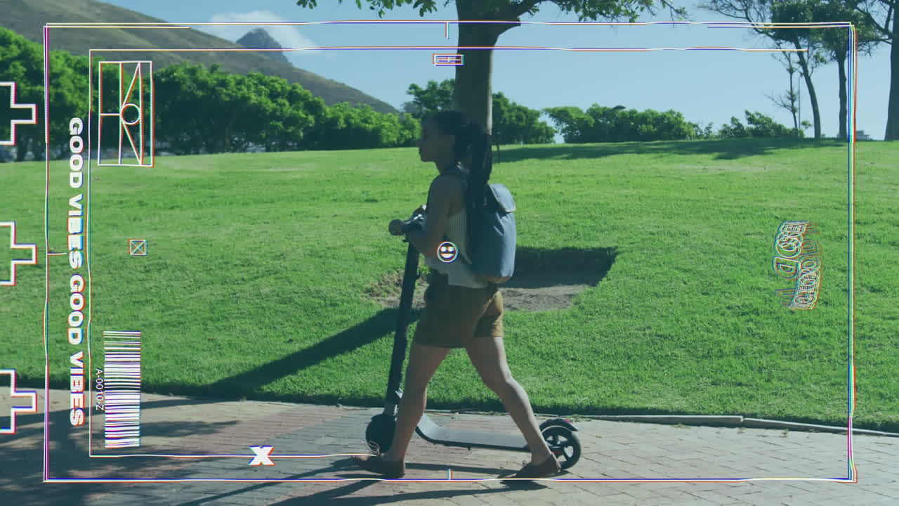 Digital camera interface against african american woman with scooter walking in the park