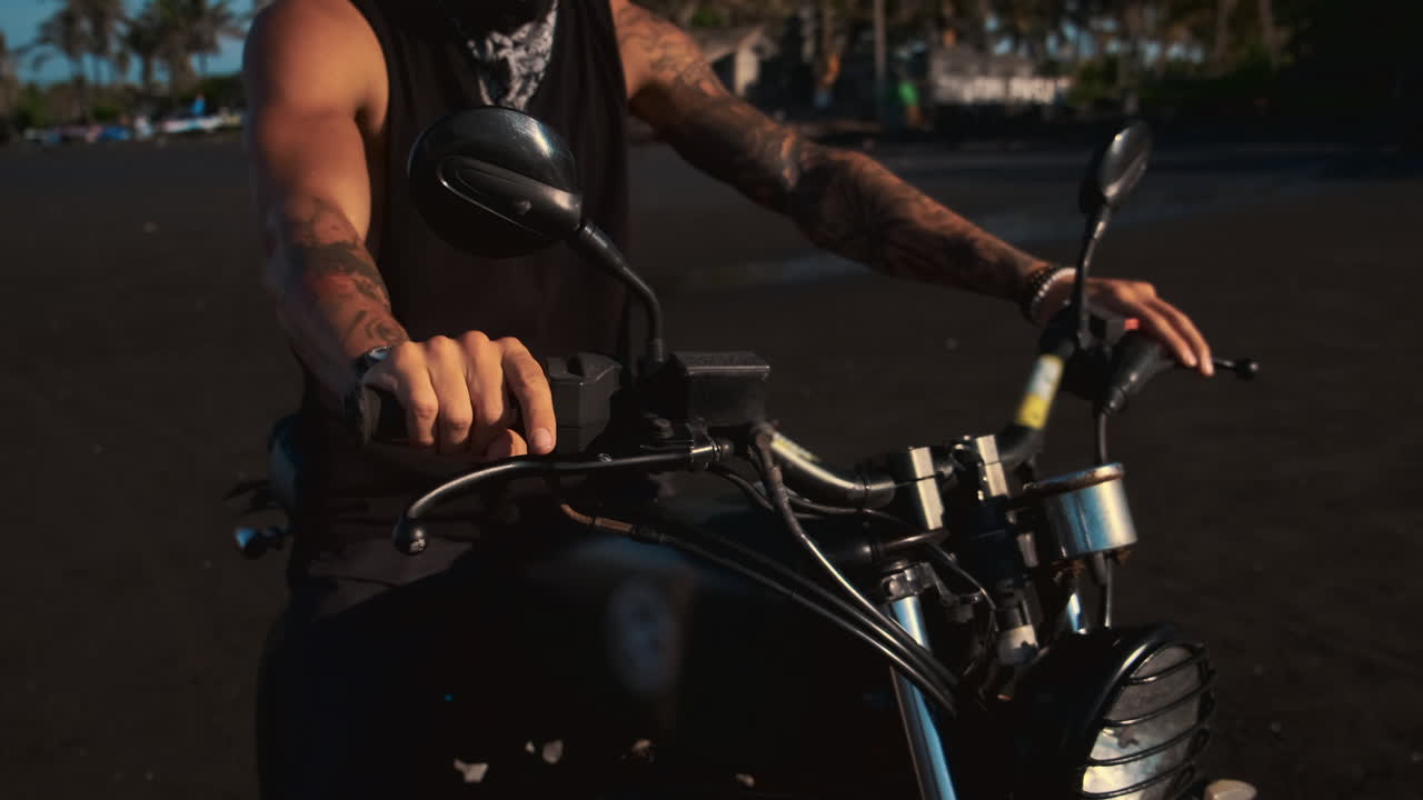Man Riding a Motorcycle on a Beach