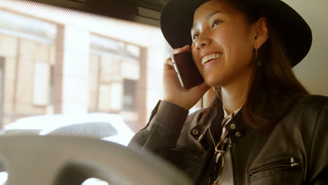 Teenage-girl-talking-on-mobile-phone-while-travelling-in-bus-4k