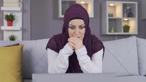 Muslim-woman-in-hijab-sad,-getting-bad-news,-reading,-listening.