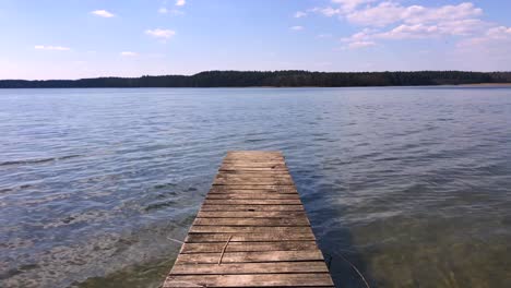 wooden pier beside a picturesque lake