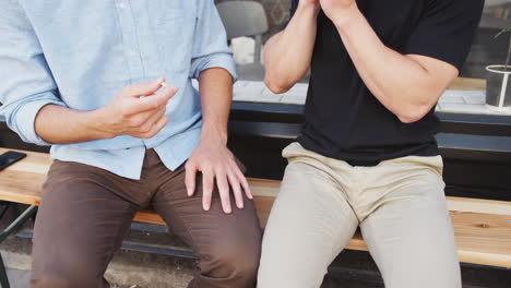 Close-Up-Of-Man-Proposing-To-Male-Partner-With-Ring