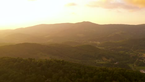 golden hour sunset haze in mountaintops of north carolina - aerial panorama