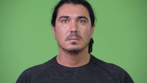handsome man against green background