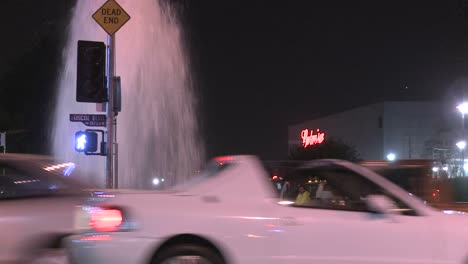 firemen try to shut of a broken water main in los angeles