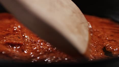cooking tomato sauce close-up. classic homemade italian tomato sauce for pasta and pizza in the pan. chef cooking traditional italian food. high quality 4k footage