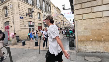 people walking and interacting on a bustling street