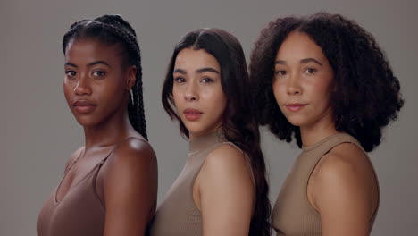 three diverse women posing together