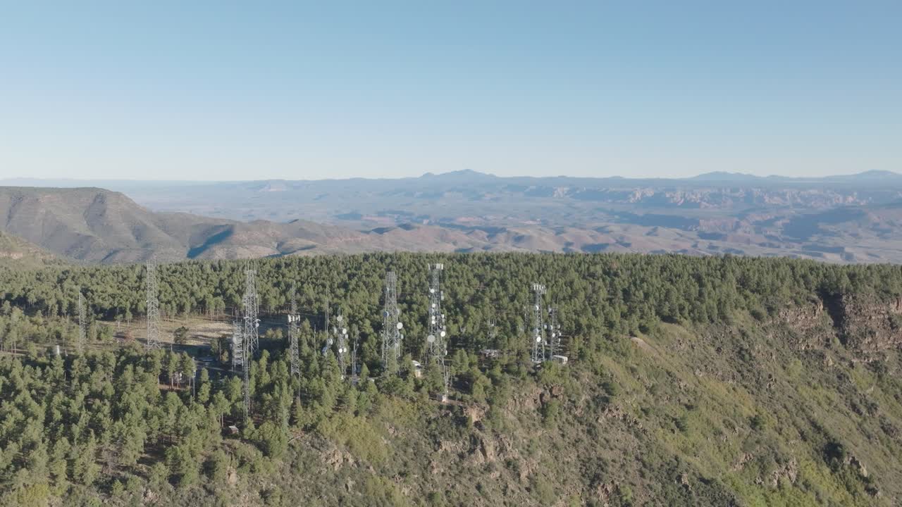 Aerial Drone Static View of Telecommunication and Radio Broadcast Towers on Forested Summit of Mingus Mountain Arizona
