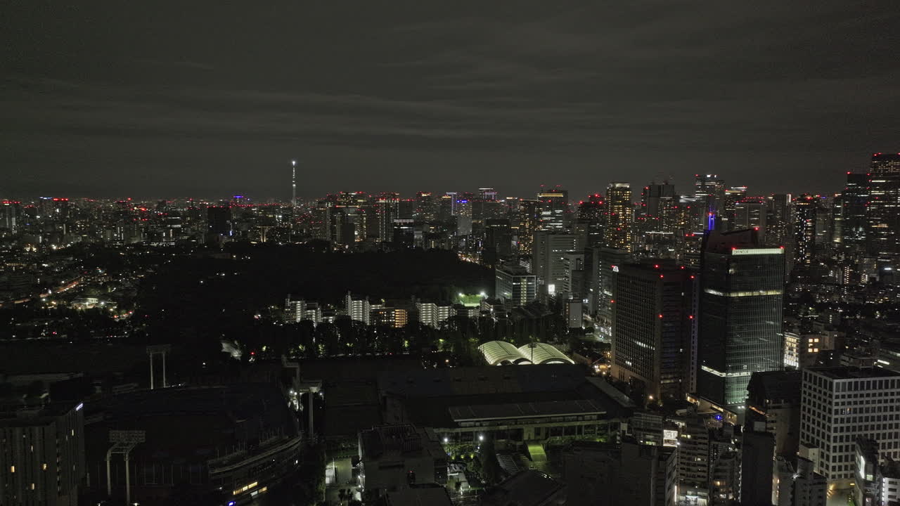 Tokyo Japan Aerial v184 panoramic panning view drone flyover Jingumae capturing illuminated Chiyoda and Shinjuku downtown urban cityscape at night - Shot with Mavic 3 Pro Cine - October 2023