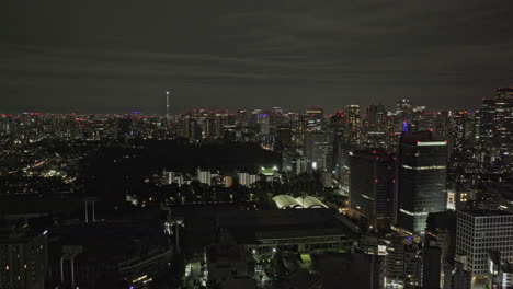 tokyo japan aerial v184 panoramic panning view drone flyover jingumae capturing illuminated chiyoda and shinjuku downtown urban cityscape at night - shot with mavic 3 pro cine - october 2023
